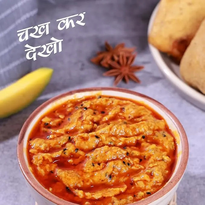 Red curry in a bowl with text and blurred background
