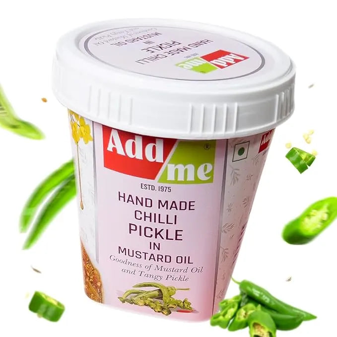 Container of Add Me hand made chili pickle with green chilies on a white background