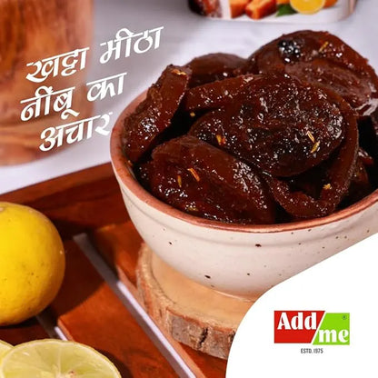 Bowl of dried fruit with lemon and wooden board, Add Me brand visible