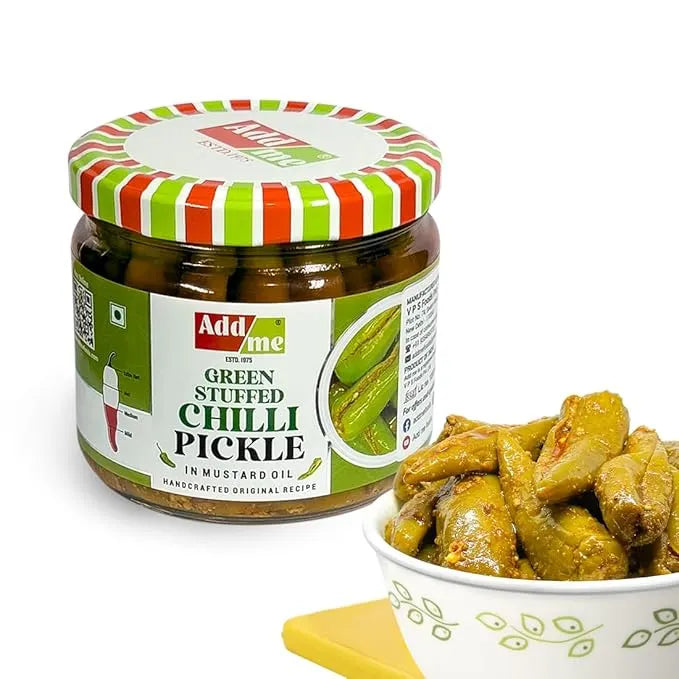 Jar of Addme green stuffed chilli pickle with a bowl of pickles on a white background