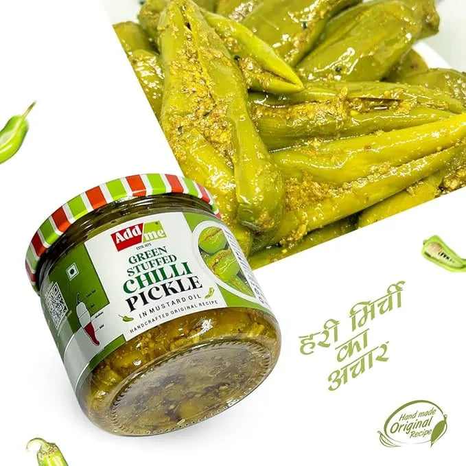 Jar of green stuffed chilli pickle with a white background