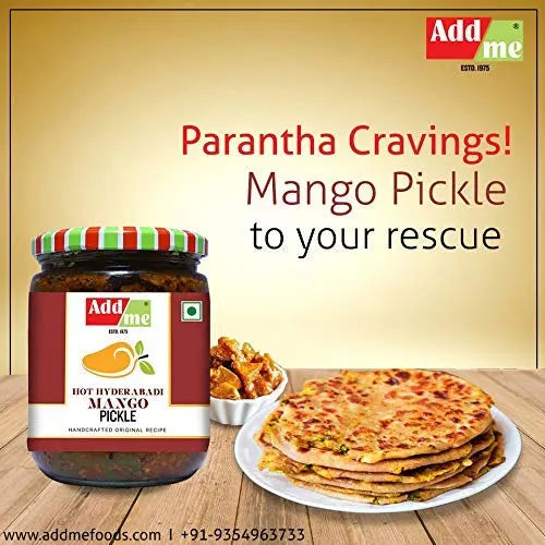 Jar of Add Me Mango Pickle with parathas and snacks on a wooden surface, featuring the brand 'Add Me'.
