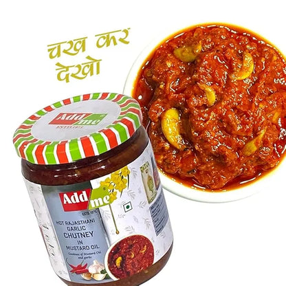 Jar of Add Me hot Rajasthani garlic chutney with a bowl of red curry on a white background