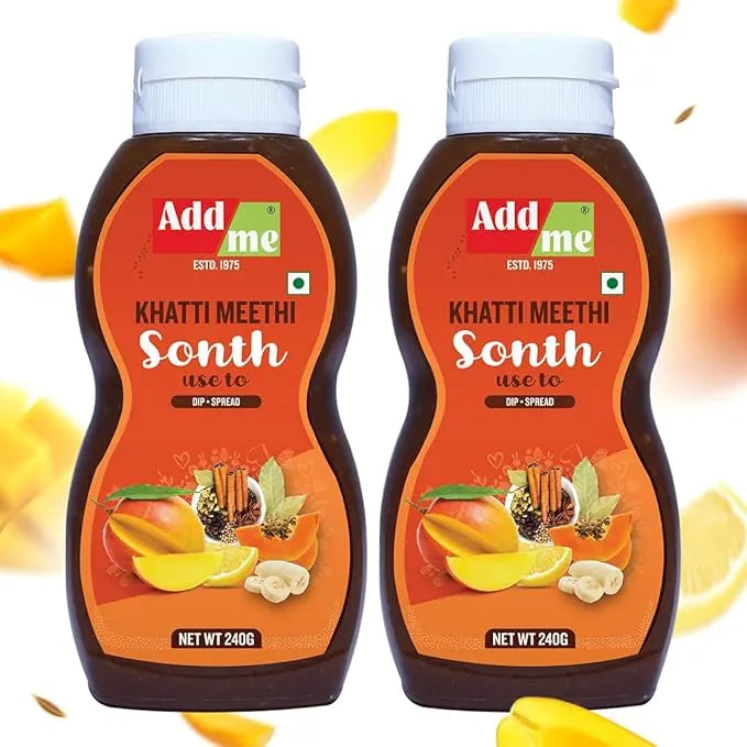 Add Me Foods: Two bottles of Add me Khatti Meethi Sonth with a white background and mangoes around.