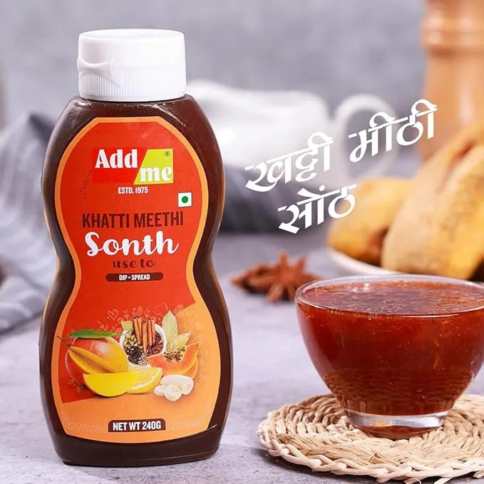 Add Me Foods: Add Me bottle of Khatti Meethi Sonth with a bowl of sonth on a textured surface.