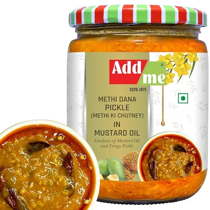 Jar of Add Me Methi Dana Pickle with a striped lid on a white background