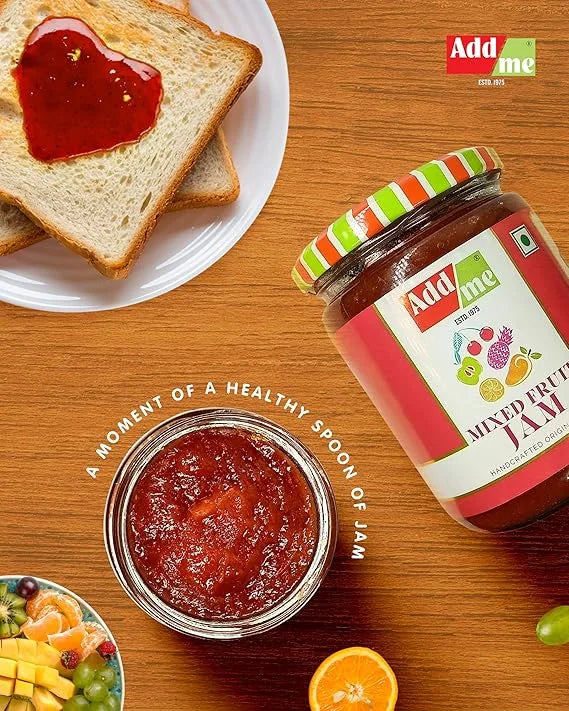 Add Me Foods: Jar of Add Me jam with toast and fruit on a wooden table