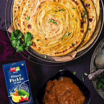 Roti with mixed pickle on a dark surface