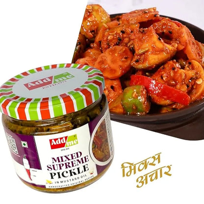 Jar of Add Me mixed supreme pickle with a bowl of pickled vegetables on a white background