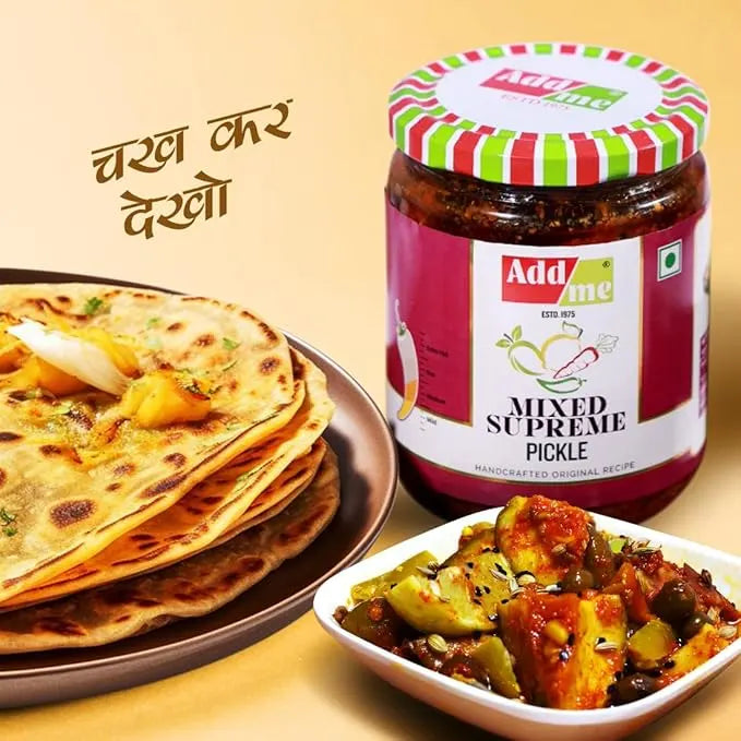 Jar of Add Me mixed supreme pickle with flatbreads and a dish of curry on a beige background