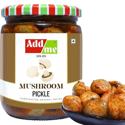 Jar of Add Me Mushroom Pickle with a bowl of pickled mushrooms on a white background
