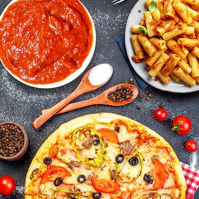 Add Me Foods: Pizza with various toppings, tomato sauce, pasta, and ingredients on a dark surface.