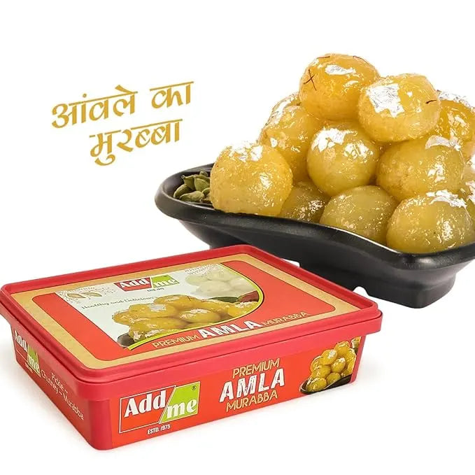 Add Me Foods: Red container of Add Me Amla Murabba with a bowl of yellow amla fruits on a white background.