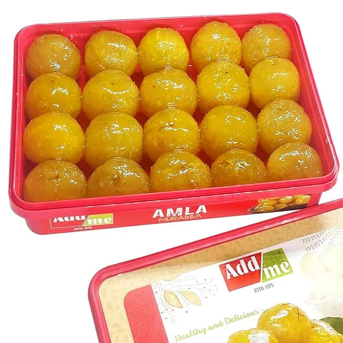 Add Me Foods: Red container filled with yellow amla fruits, branded 'Add Me'.