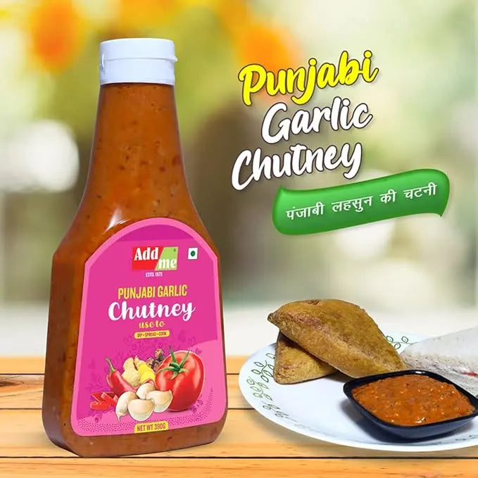 Bottle of Punjabi Garlic Chutney with a plate of food in the background