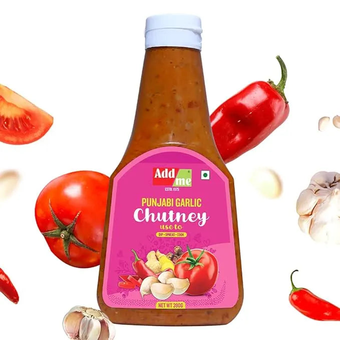Bottle of Punjabi Garlic Chutney with tomatoes, garlic, and red chili peppers on a white background