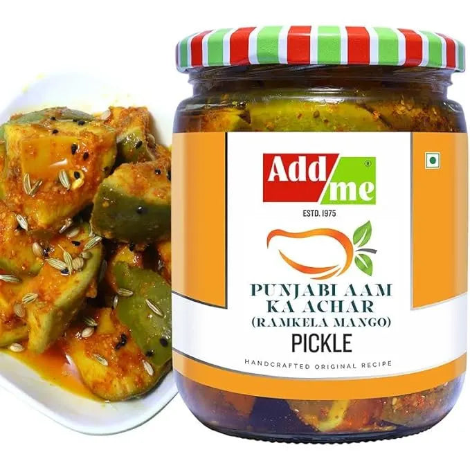 Jar of Add Me Punjabi Aam Ka Achar pickle with a side dish of pickled vegetables.