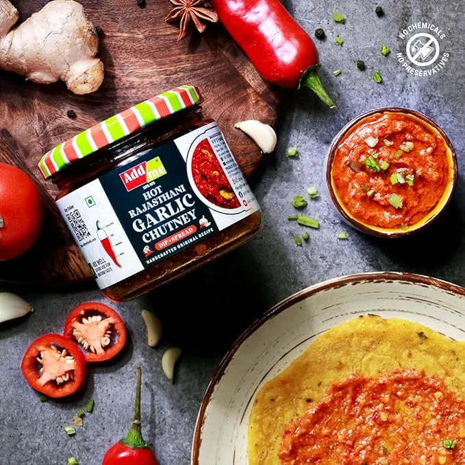 Jar of Amdo Hot Radish Garlic Chutney with ingredients on a wooden board