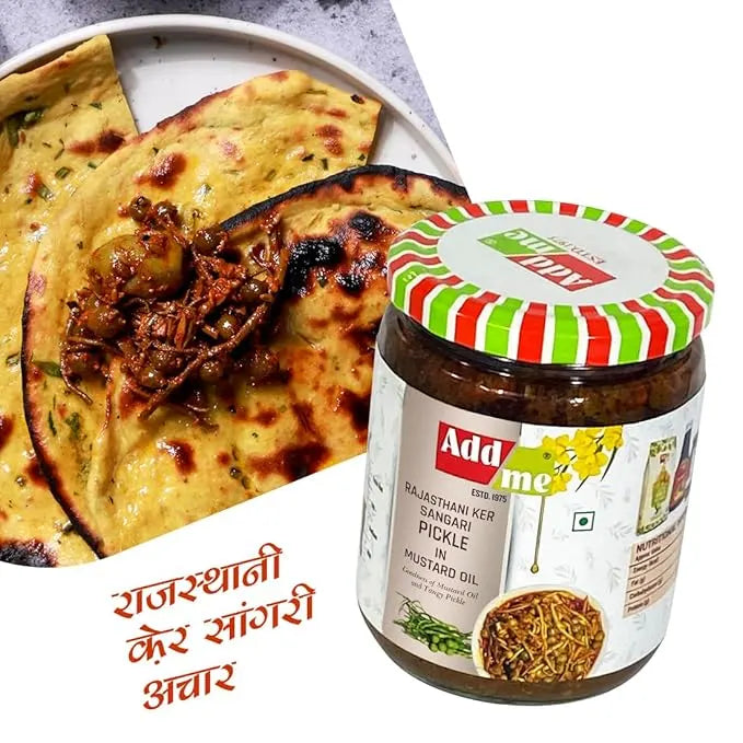 Jar of Add Me pickle with naan bread and curry on a white background