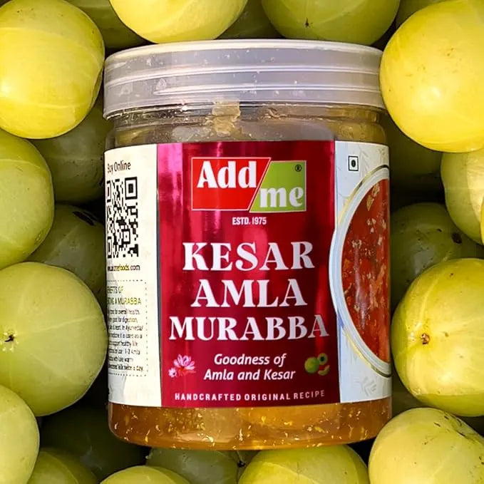 Jar of Kesar Amla Murabba with a red label on a background of green fruits
