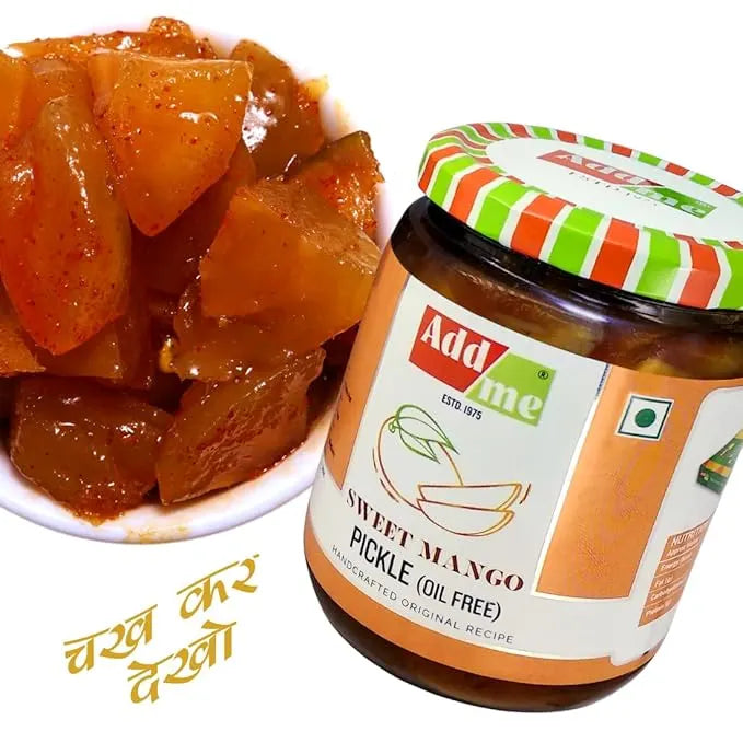 Jar of Add Me Sweet Mango Pickle with a bowl of pickles on a white background