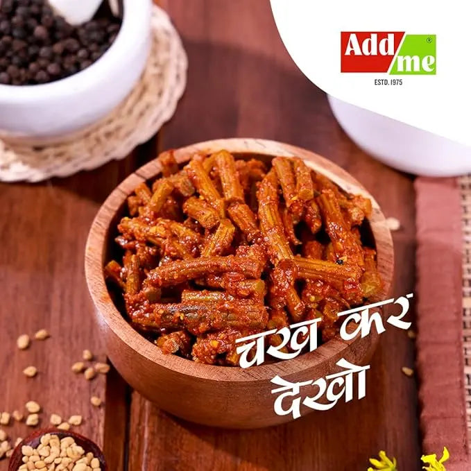 Spicy snack sticks in a wooden bowl with Addme branding on a wooden surface.