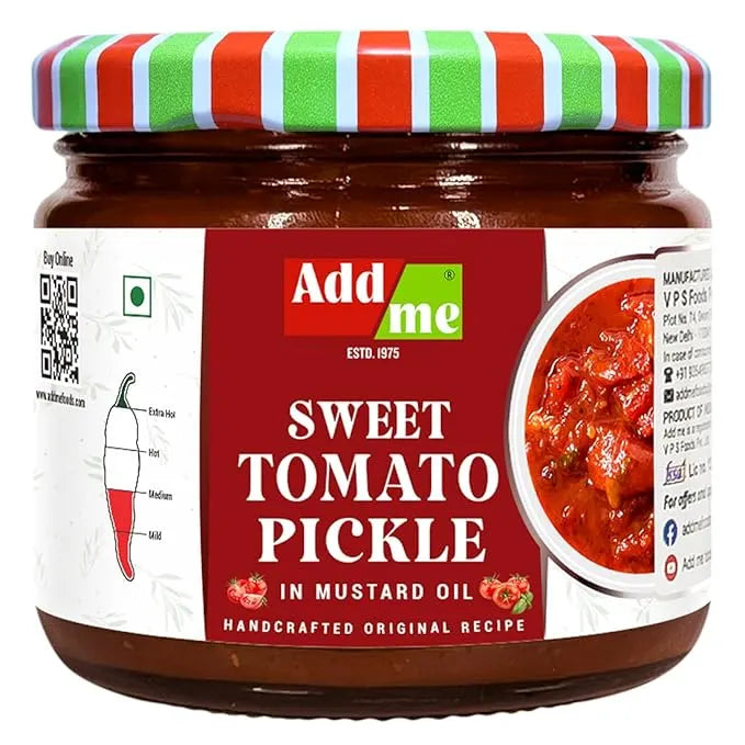 Jar of sweet tomato pickle with a colorful lid on a white background