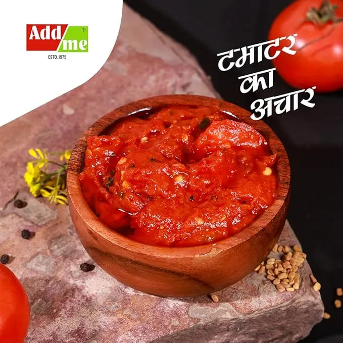 Wooden bowl of red chutney with tomatoes and spices on a stone surface, featuring Addme logo.