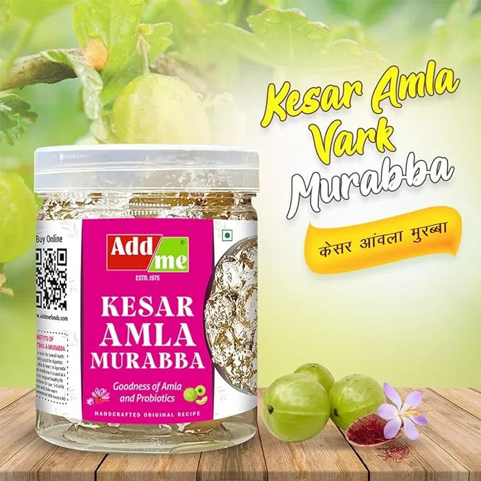 Add Me Foods: Jar of Kesar Amla Murabba with Add Me branding on a wooden surface with green fruits in the background.