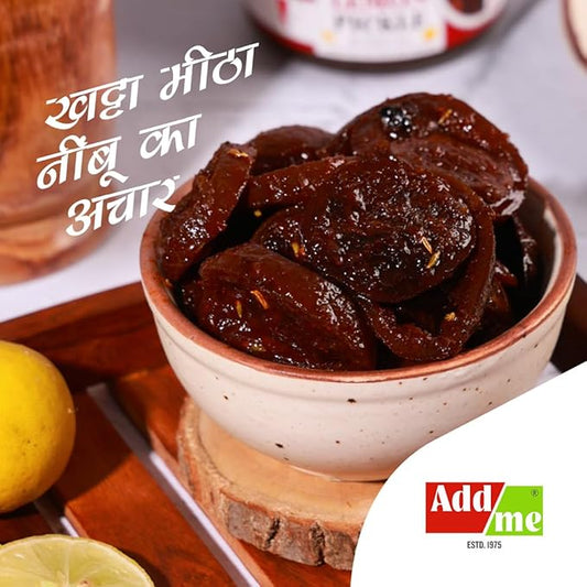 Bowl of dried fruit with lemon slices on a wooden board, featuring Add Me brand. sweet lemon pickle